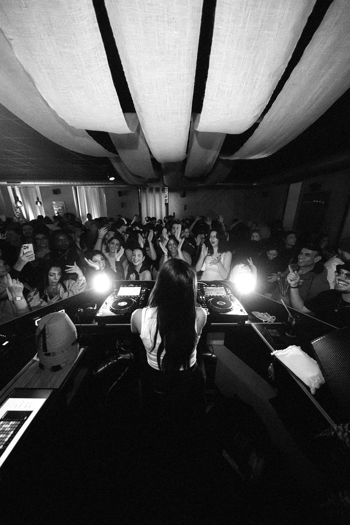 GUAPPA seen from behind the booth, facing a packed room