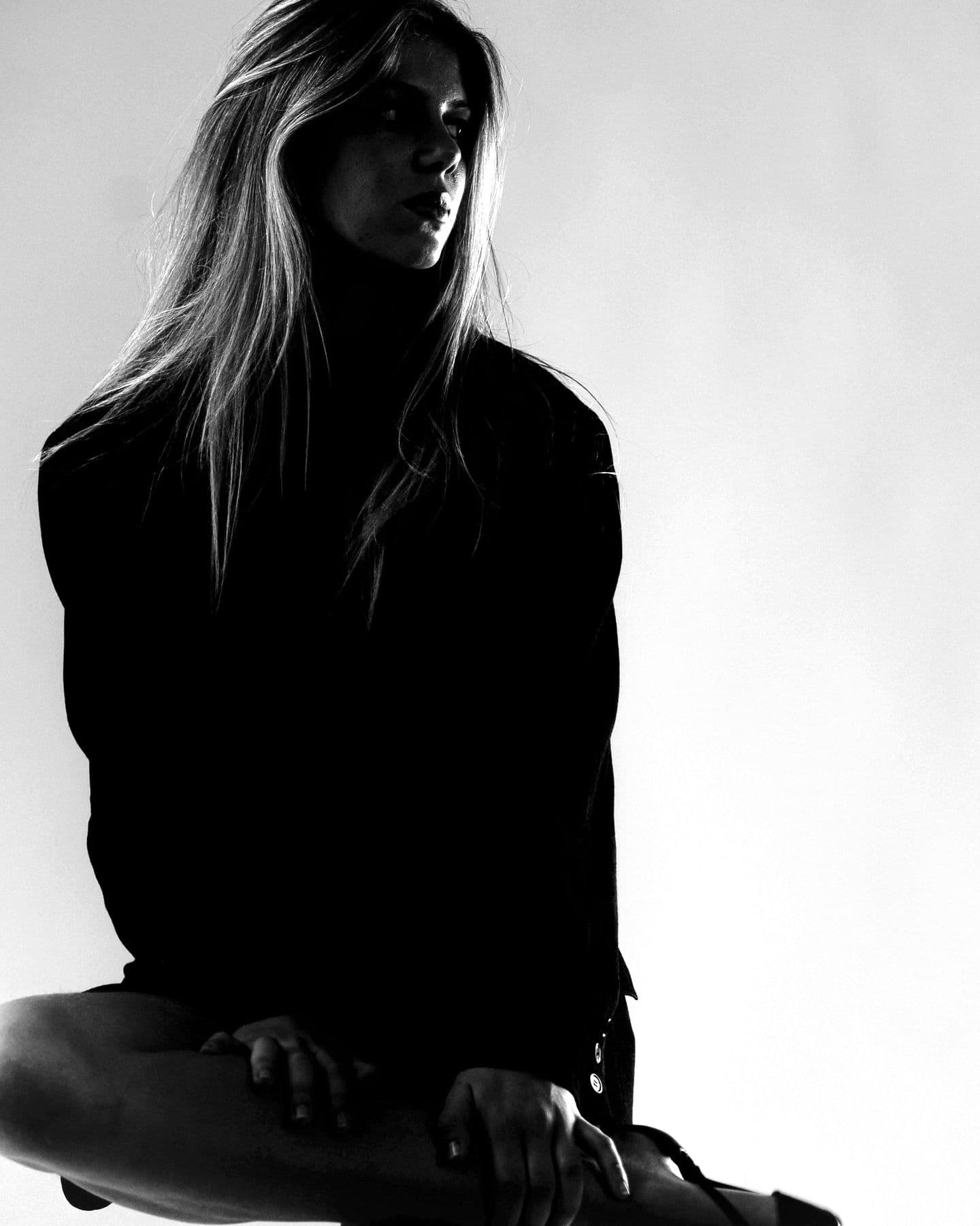 Portrait of MYKANA in a dark blazer